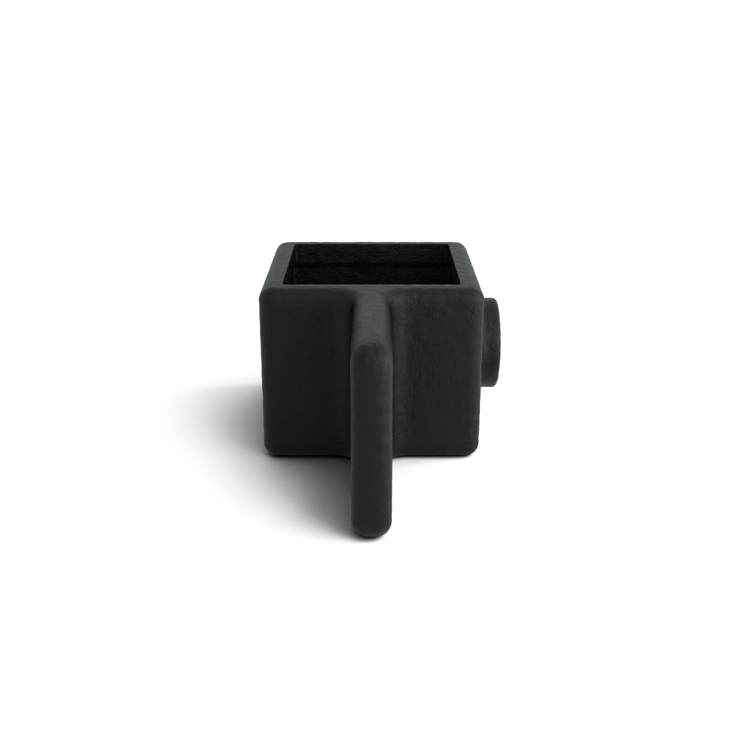 A square, jet-black planter with a rough texture is displayed against a white background. At the front, a flat, vertical protrusion forms a handle; at the back, a short cylindrical shape juts out. A soft shadow lies beneath it.