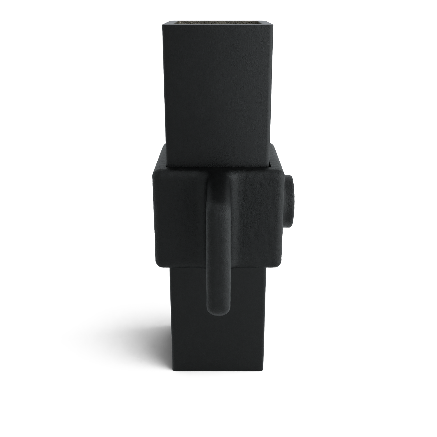 A black, modular item consisting of stacked geometric forms: a wide rectangular block as the main body, with a round handle and a cylindrical bulge. On top, a narrower, open rectangular block. The matte, slightly textured surface casts shadows.