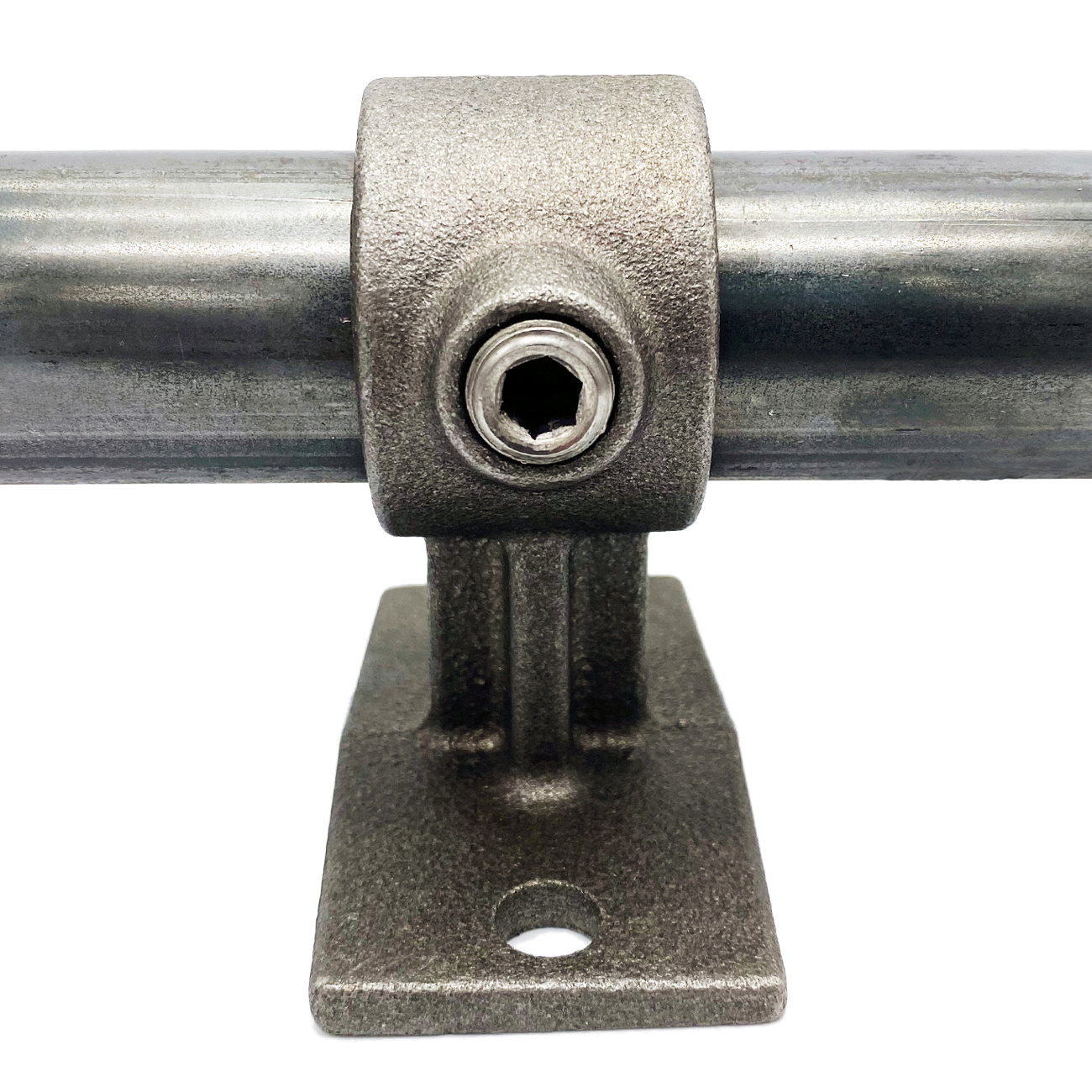 Detailed view of a robust, dark grey handrail bracket that secures a polished metal handrail (42.4 mm diameter) horizontally. An Allen key is inserted into the screw. Slightly textured surface.